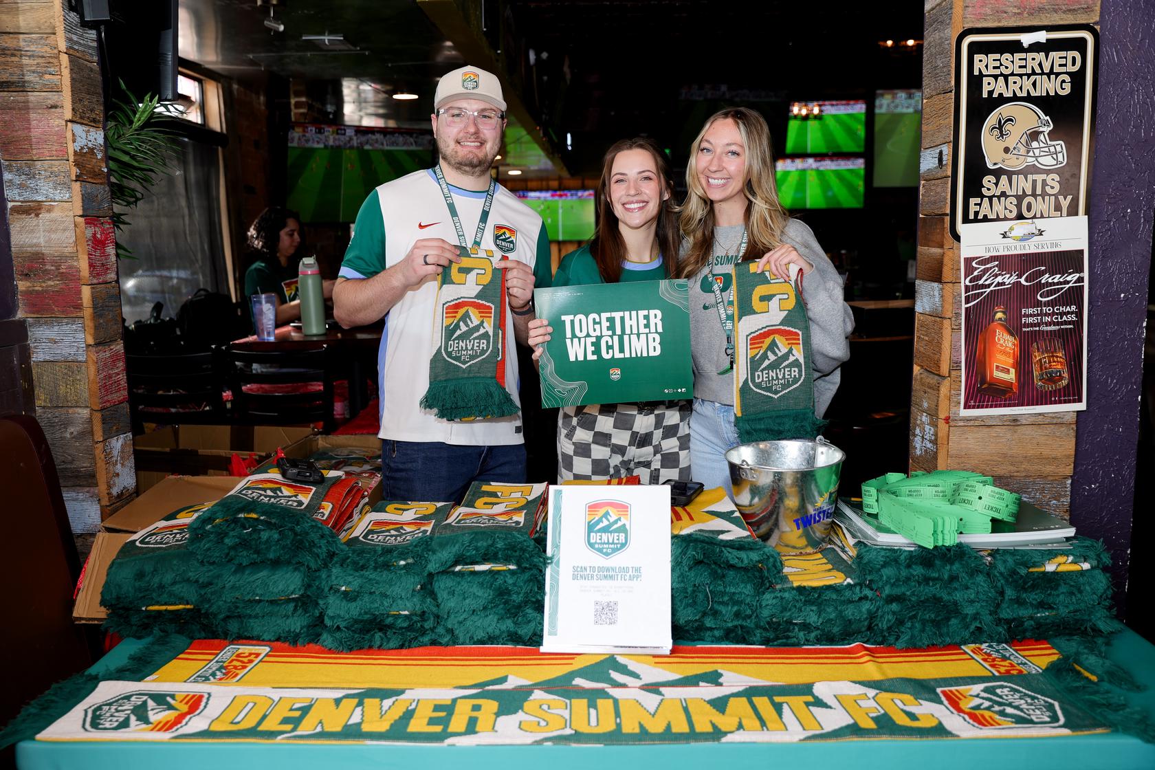 Club 5280 scarves being passed out at a watch party